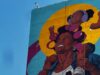 Angurria pinta en el Bronx el mural más alto de Estados Unidos: una mujer en rolos a 29 pisos de altura